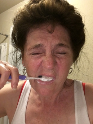Janet M. Nast brushing her teeth